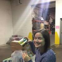 Alumna helps package food